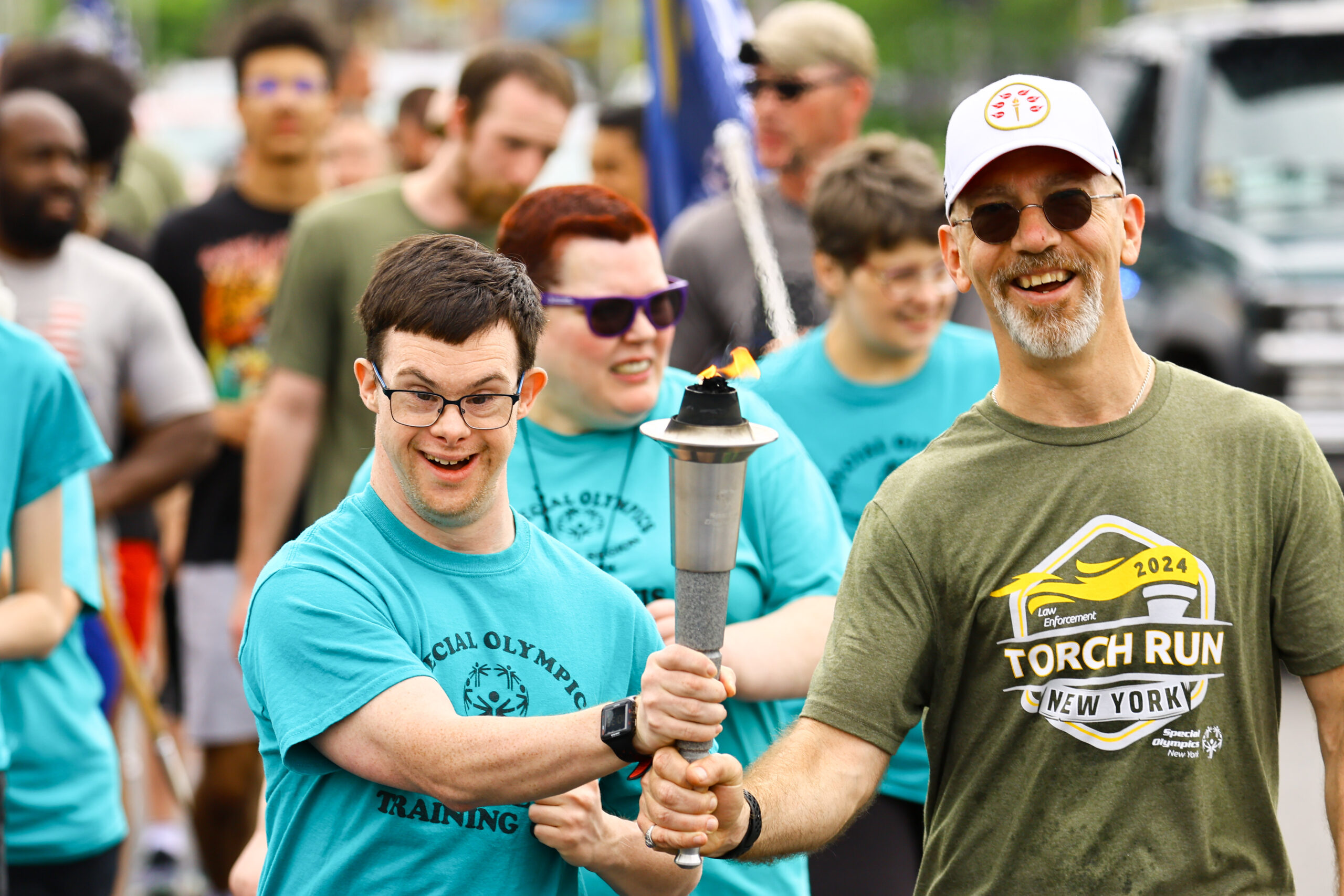 torch with law enforcement and athlete