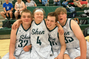 Four Unified teammates smile together in a fun picture.