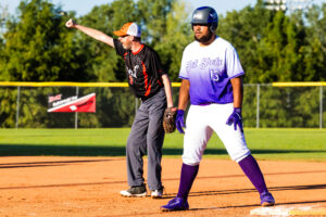 A Hot Shots athlete awaits at first base.