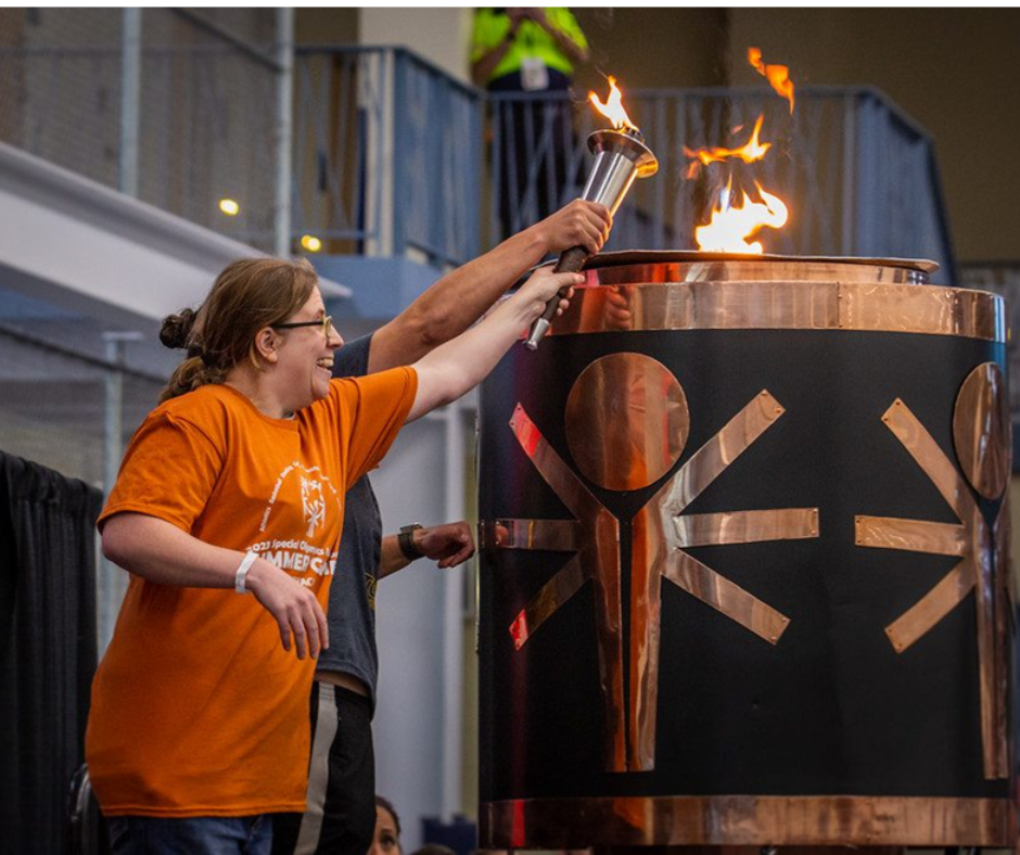Dryden’s Anne Norby lights the ceremonial torch during the opening ceremonies of the 2023 Special Olympics New York Summer Games. Ithaca will host the Games for the third straight year, beginning on June 14. Photo Credit: Devan Accardo